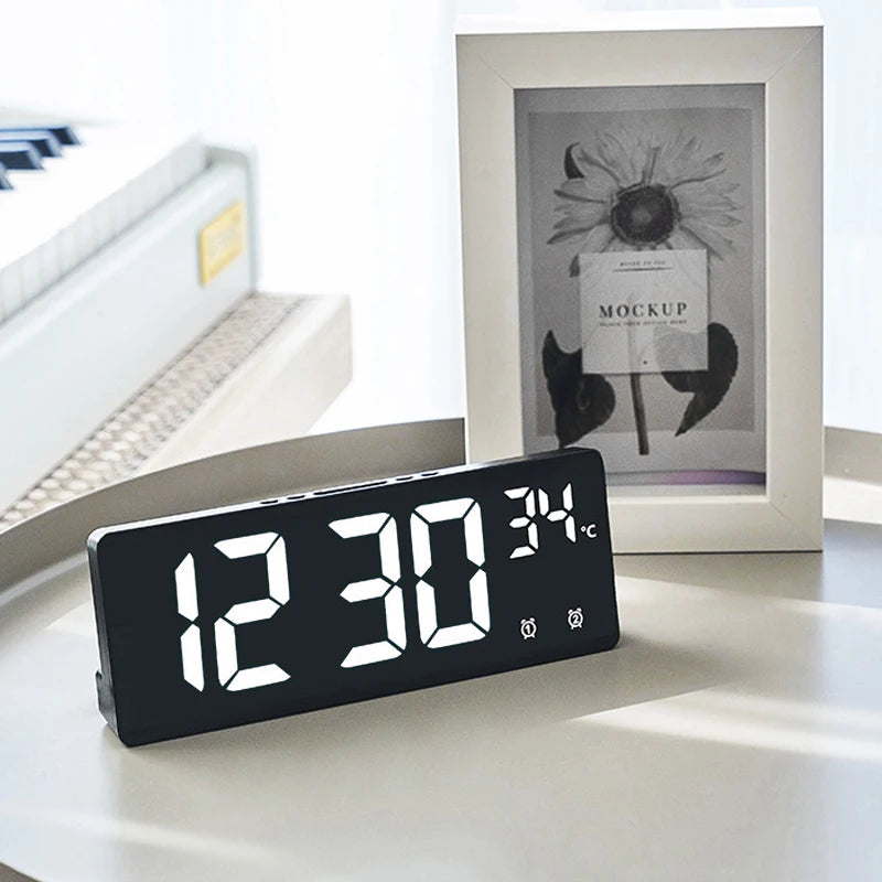 LED digital alarm clock on a desk with large display and temperature reading, ideal for bedroom or home office BeTrendy